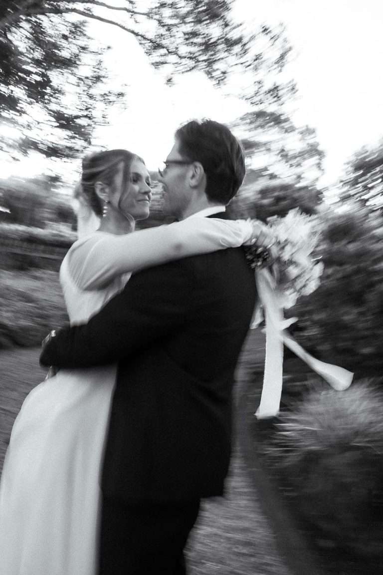 A couple laughing and embracing