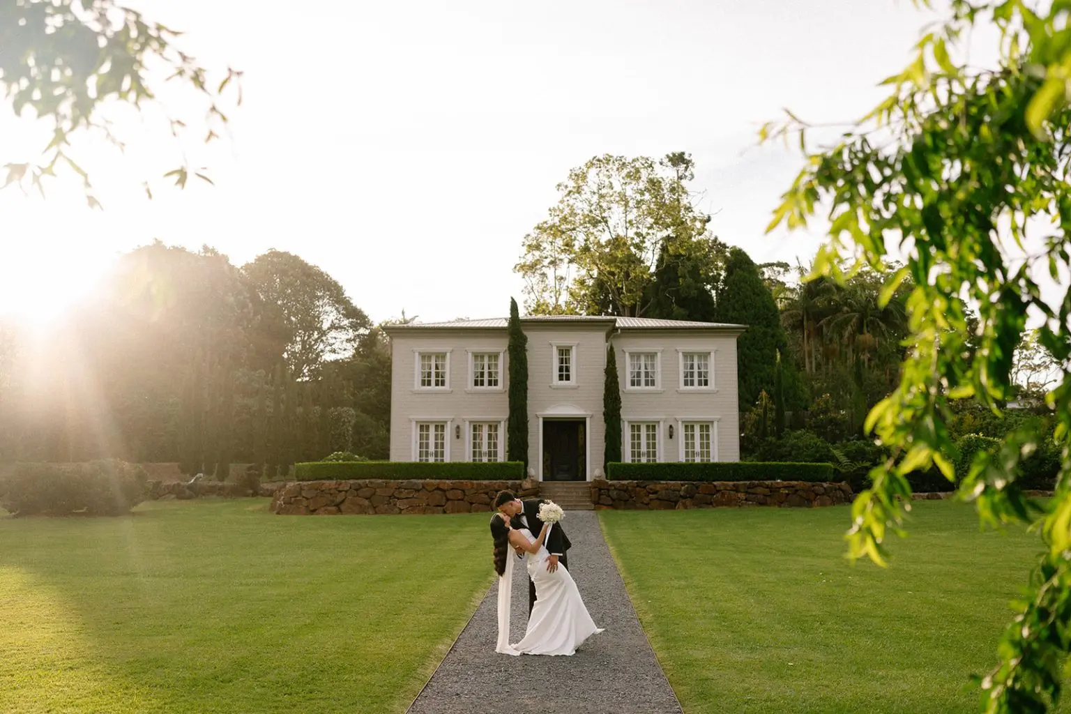 A couple together in the golden evening light at Wynmere Estate